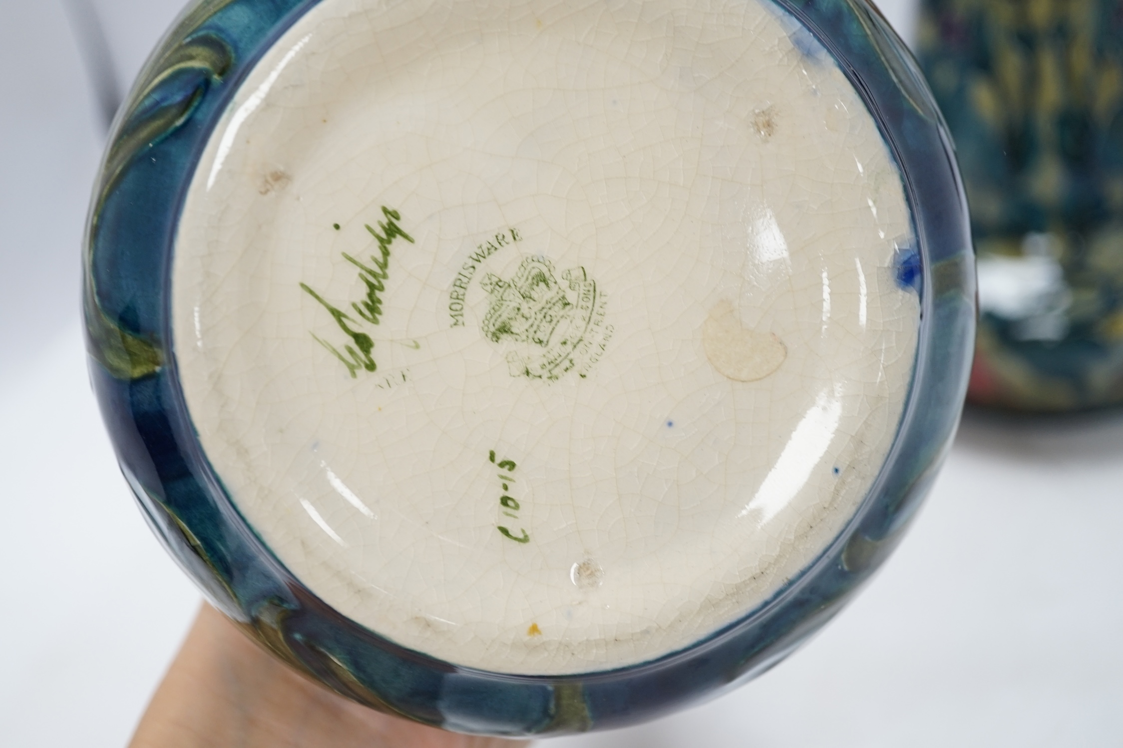 A pair of Hancock & Sons Morrisware vases, and another, designed by George Cartlidge, decorated with stylised flowers, 24cm high. Condition - fair to good, crazing throughout